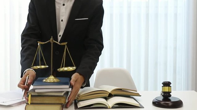 Asian lawyer prepare documents on the table in a lawyer's office.