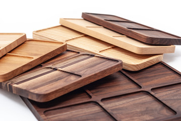 Shaped wooden boards in row on white background