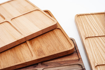 Shaped wooden boards in row on white background