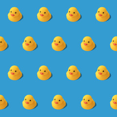 repeatable pattern of yellow rubber duck on blue background Modern style. creative photography.