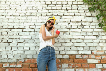 A young girl talking on the phone.