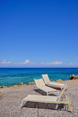 parasol made of reeds with the sea in the background a sunny summer day