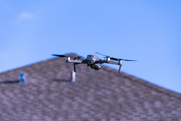 Camera drone spying on neighborhood house