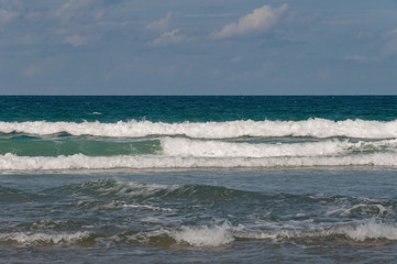 Ocean view with rough waves and calm horizon over water