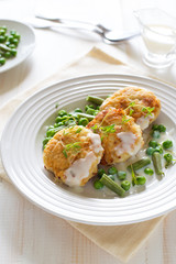 Fish cutlets with green peas and beans