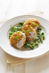Fish cutlets with green peas and beans