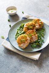Fish cutlets with green peas and beans