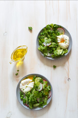 Fresh vegetable salad and poached eggs