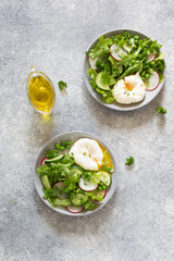 Fresh vegetable salad and poached eggs