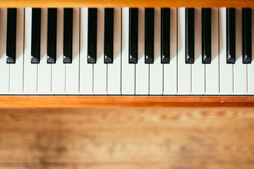 Vintage wooden piano keys, wooden blurry floor