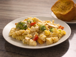 Pasta Primavera with Chicken Slices in White Sauce and a side of Toasted Garlic Bread 