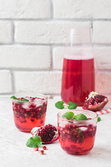 Festive pomegranate kombucha mocktaill. Selective focus, space for text.