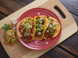 Soft Tortilla Tacos with Spicy Sauce and Tomato Onion and Cilantro 