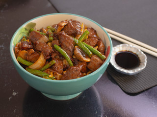 Bowl of Asian Food Style Angus Meat with Vegetables and Soy Sauce 