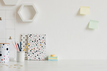 Modern and stylish home interior with elegant office accessories, notes, memo sticks, pencils and...