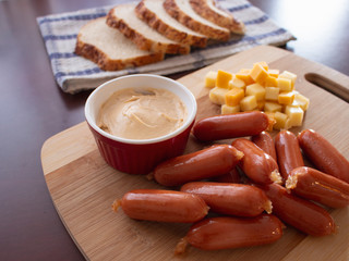 Mini Smoked Sausages Cocktail Wieners with Spicy Dip Mix of Cheese Cubes and Potato Bread Slices 