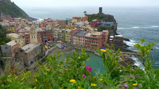 Steadicam shot of Vernazza, Cinque Terre, Italy. Elegant colorful houses are seen in the background. Vernazza is a town in Italian Riviera on the coast of Ligurian Sea. UHD