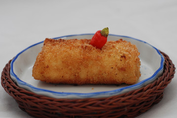 Fried brown mayonnaise cake with a long, coarse-textured shape