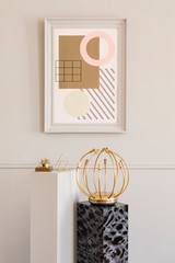 Minimalistic and luxury living room of apartment interior with elegant marble and gray stands and gold design lamp. Mock up paintings frame on the molding gray wall. Stylish home decor. Template.