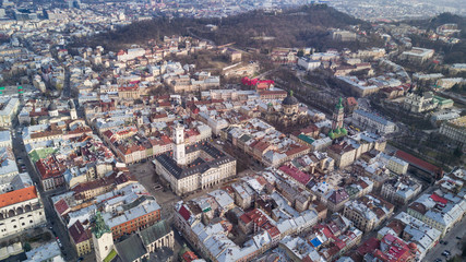Obraz premium Rooftops of the old town in Lviv in Ukraine during the day. The magical atmosphere of the European city. Landmark, the city hall and the main square.