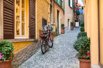 Fototapeta premium Old picturesque street with amazing view in beautiful Bellagio, Como lake, Italy