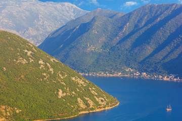 Large scale view of the Bay of Kotor from above. Mountains, sea and a lonely ship