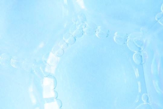 Macro soap bubbles, blue abstract background. Scientific photo of cell or cell membrane