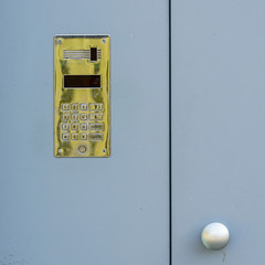 access control door box with numeric keypad on grey background
