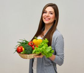 smiling woman holding dieting vegetables set.