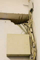 tangled network cables and wires in server room