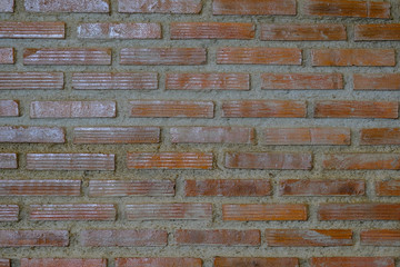 Close up of brown orange brick cement wall. Use for background or wallpaper