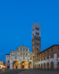 Fototapeta na wymiar Front facade of St Martin Cathedral and tower in the historic centre of Lucca, Tuscany, Italy