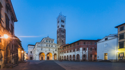 Front facade of St Martin Cathedral and tower in the historic centre of Lucca, Tuscany, Italy - obrazy, fototapety, plakaty