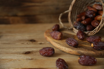 dates in a basket on wooden natural background