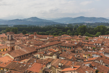 Fototapeta na wymiar Architecture and buildings of Lucca, Tuscany, Italy, with mountain landscape in the distance