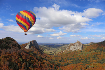 Hot air balloon flying over volcano landscape in puy-de-dome auvergne france