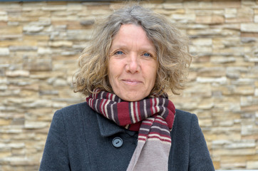Attractive middle-aged woman with quiet smile