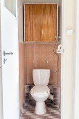 Fototapeta na wymiar Close-up old flush toilet in house, old design WC.