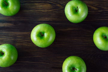 Fresh green apples on wooden background. Copy spase place