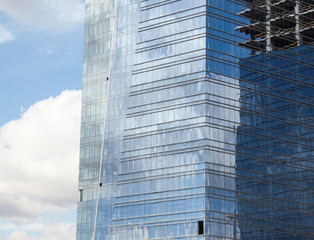 Fototapeta premium Office building construction. Mirror windows.