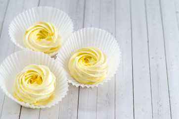 Lemon Meringue Marshmallow Zephyr On Wooden Background.