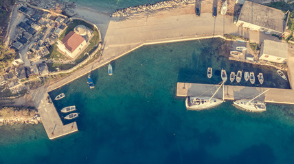 Drop down view of coastal village at sunset.