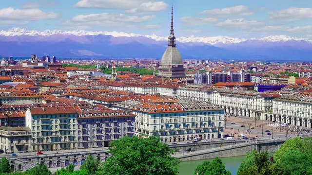Turin, Torino, aerial timelapse skyline panorama with Mole Antonelliana, Monte dei Cappuccini and the Alps in the background. Italy, Piemonte, Turin.