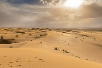 Fototapeta na wymiar Sunset in the sand dunes of Dasht-e Kavir, Iran.