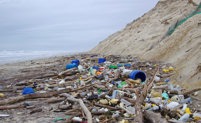 garbages, plastic, and wastes on the beach after winter storms. Atlantic west coast of france. Every day, waste accumulates on the beach of Atlantic west coast