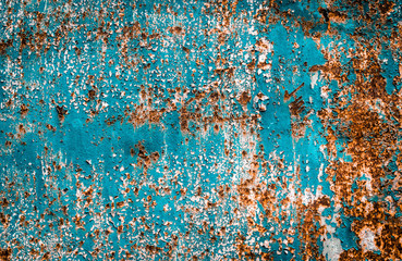Rusty brown iron texture, blue old fence with peeling paint. Textured wallpaper for design.