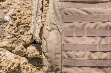 Close up detail of the exterior webbing on a tactical backpack that allows for customization via...