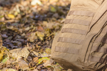 Fototapeta na wymiar Close up detail of the exterior webbing on a tactical backpack that allows for customization via pouch attachment systems.Tactical backpack color coyote