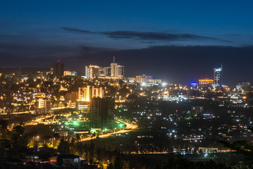 Kigali city centre skyline and surrounding areas lit up at night