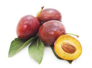 Blue plums with leaves.